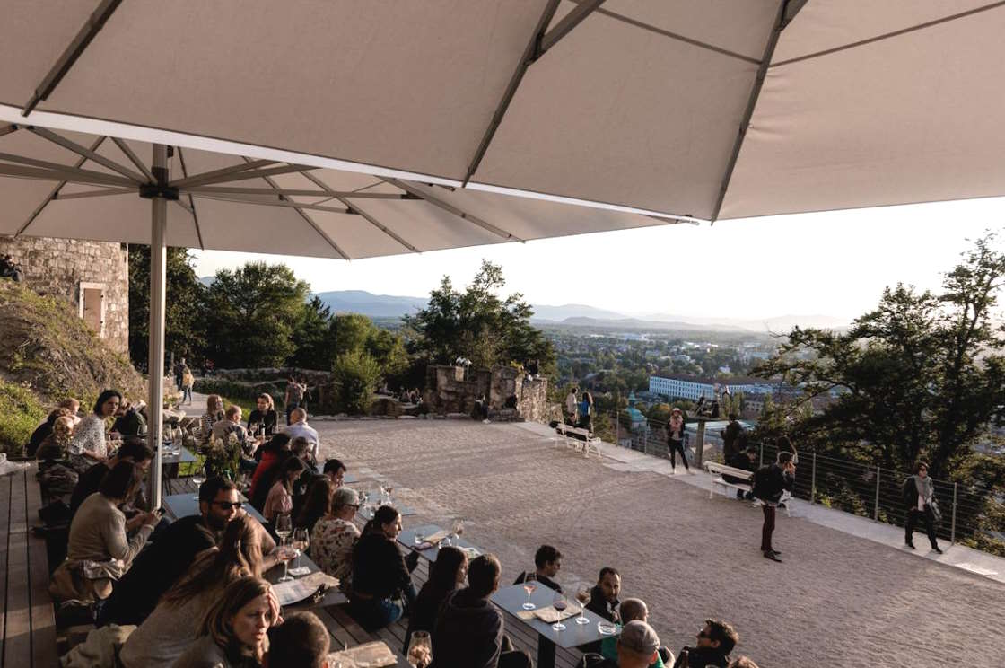 Outdoor seating with a view from the castle wine bar