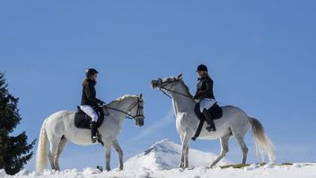 Riding vacation at lake Achensee, female riders in the snow
