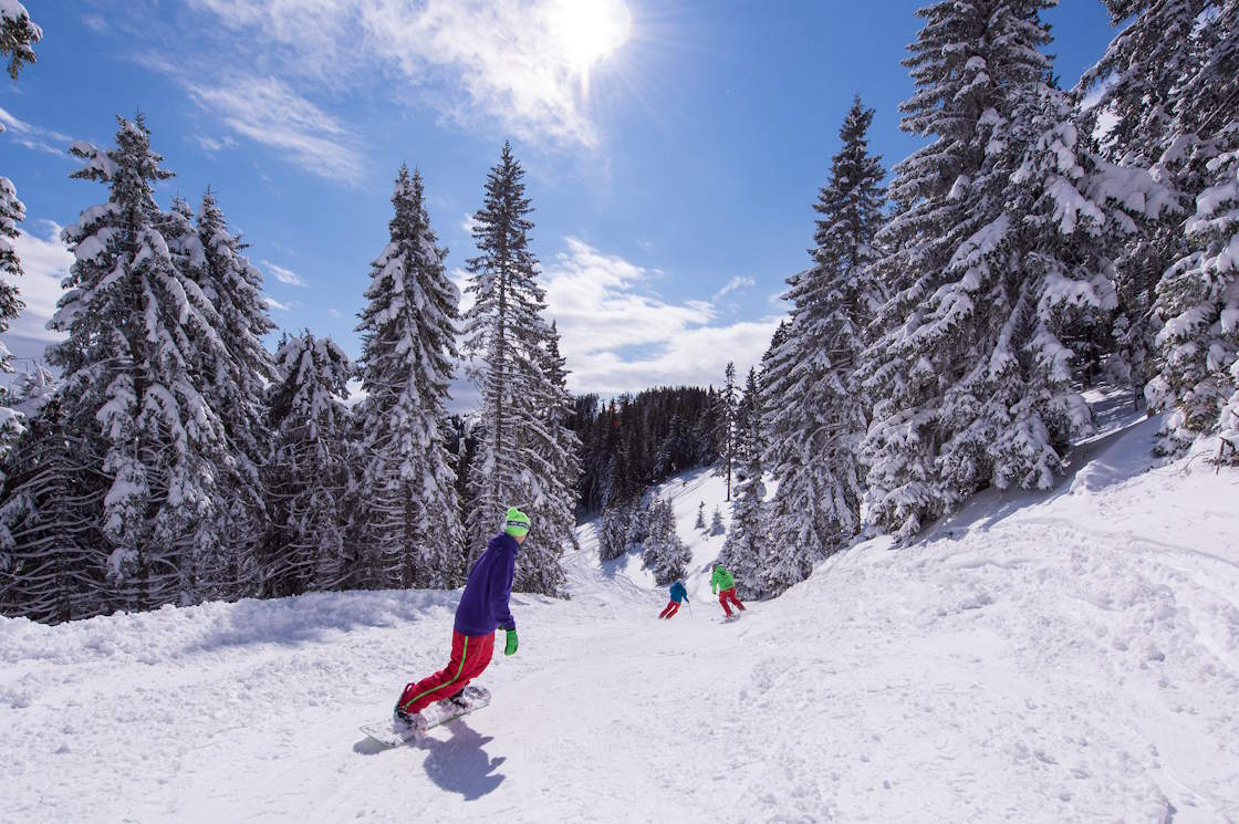 Winter fun in the Golte ski area, snowboarding